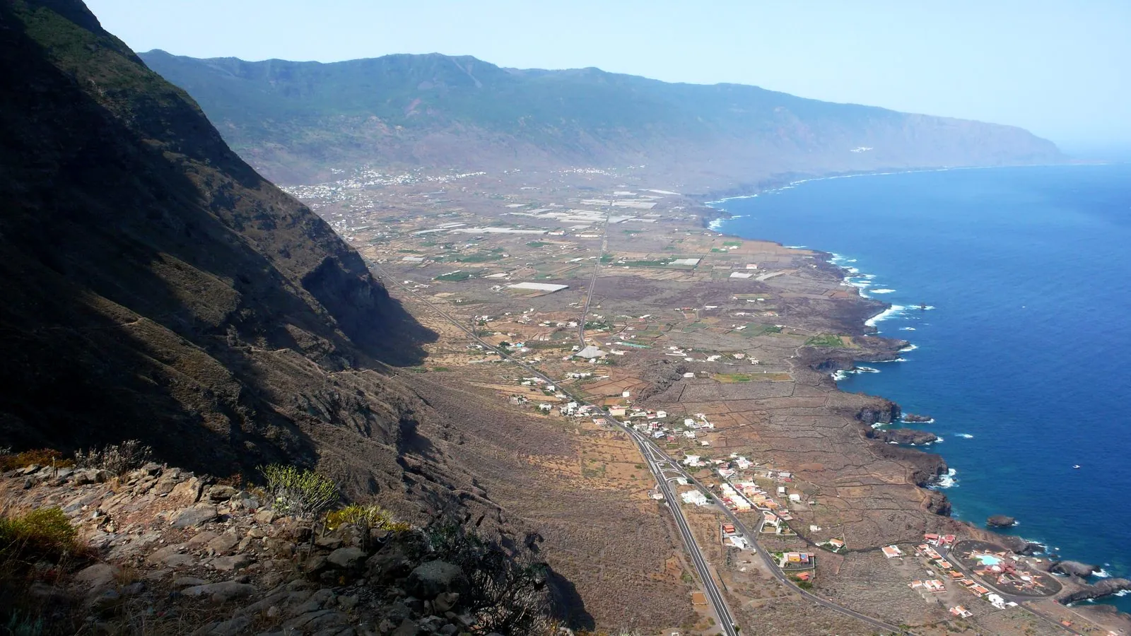 The green El Golfo valley and its rugged coastline, home to the La Maceta rock pools, on El Hierro