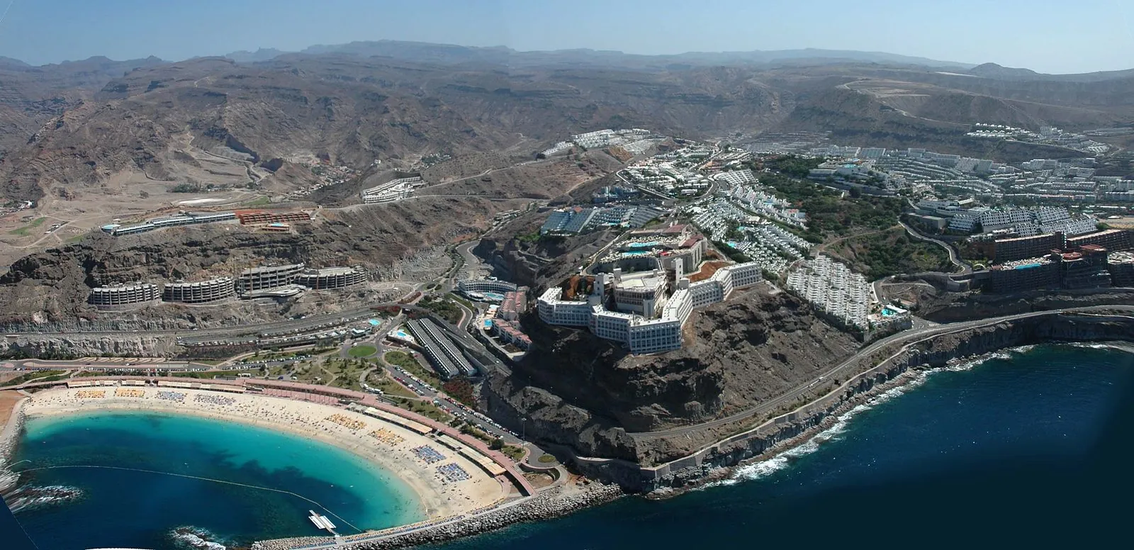 Aerial view of the man-made Amadores beach and its calm turquoise bay on Gran Canaria