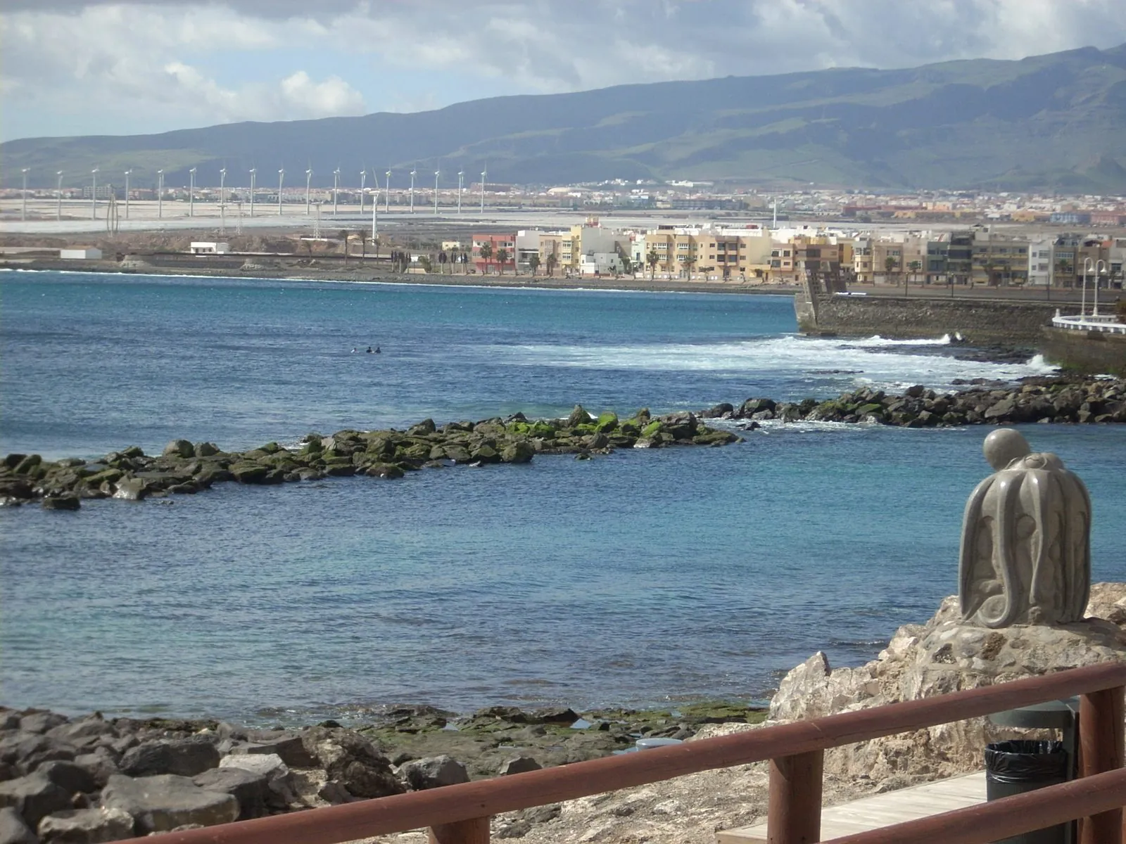 The rocky shoreline and village of Arinaga, Gran Canaria