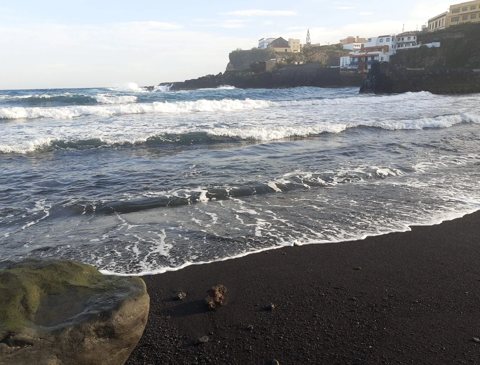 Atlantic surf on the black sand beside the Charco Azul rock pools, La Palma