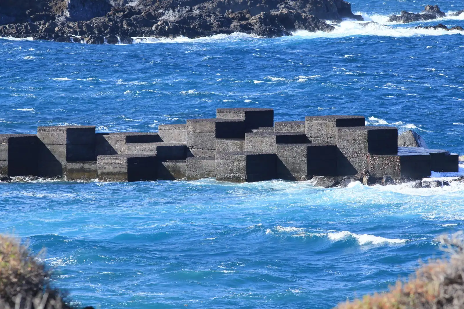 Volcanic rock and dark sand at Playa de Los Cancajos, Breña Baja, La Palma