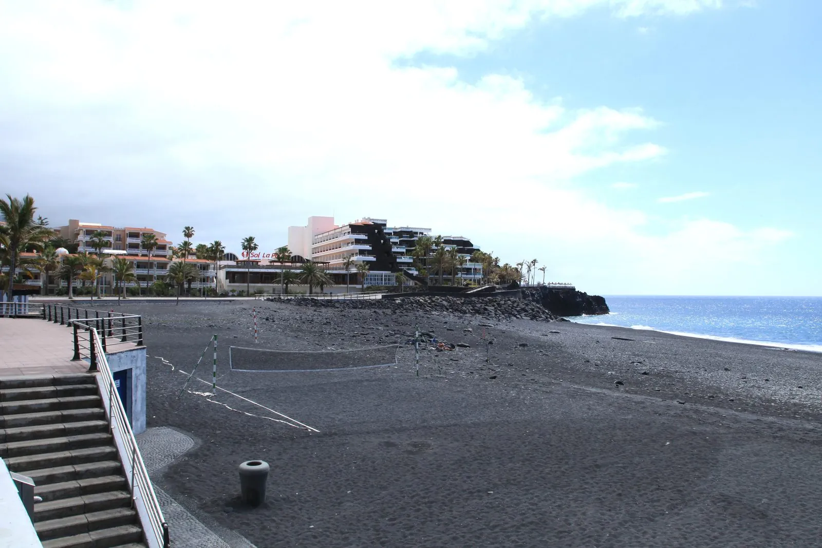 The black-sand beach and palm promenade of Puerto Naos on the west coast of La Palma
