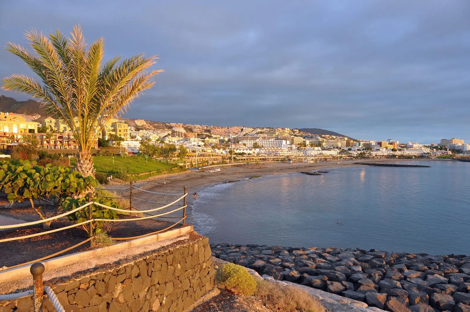 Sunbeds and promenade along Playa de Fañabé, Costa Adeje, Tenerife