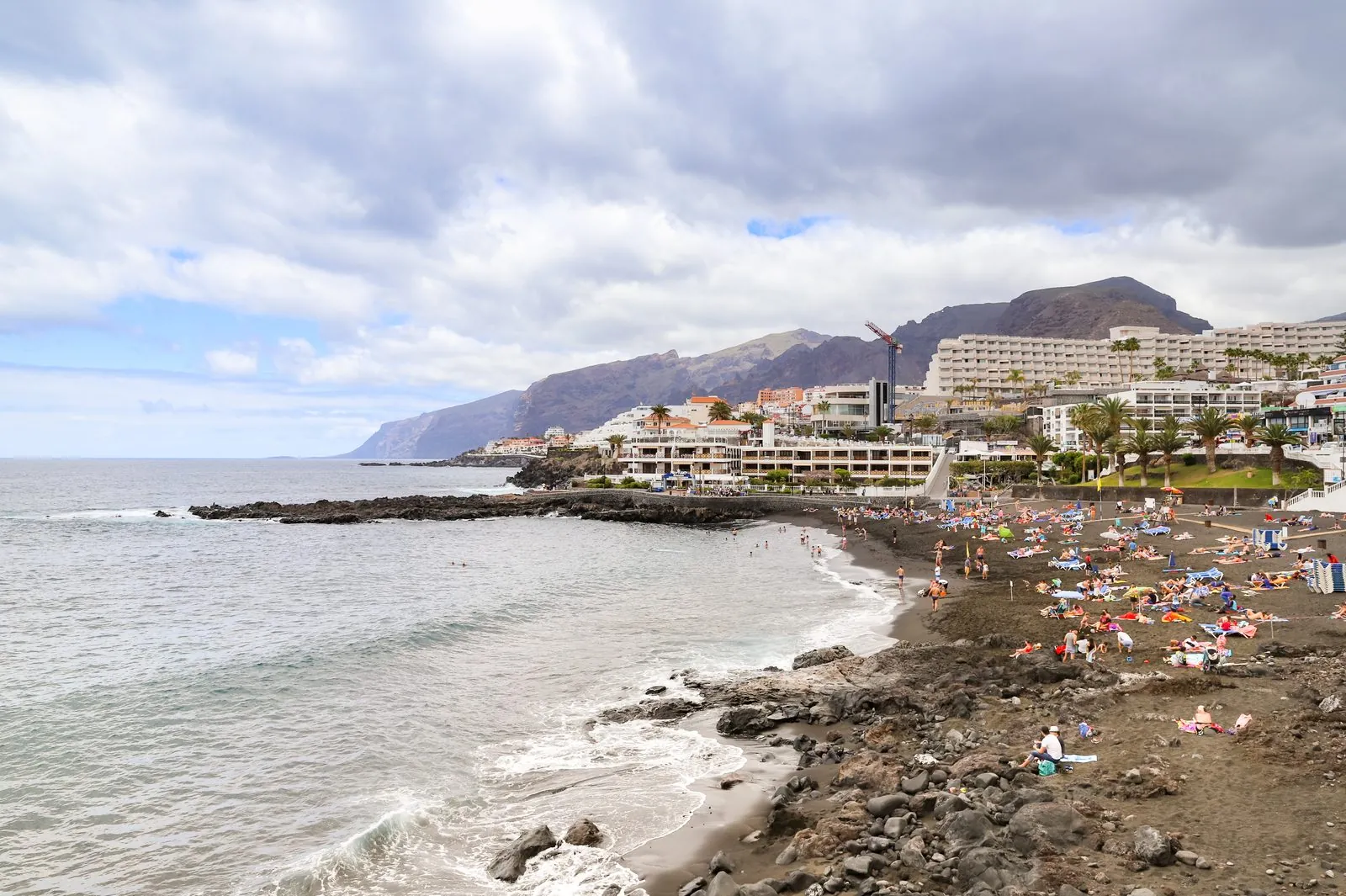 The dark volcanic sand of Playa de la Arena at Puerto de Santiago, western Tenerife