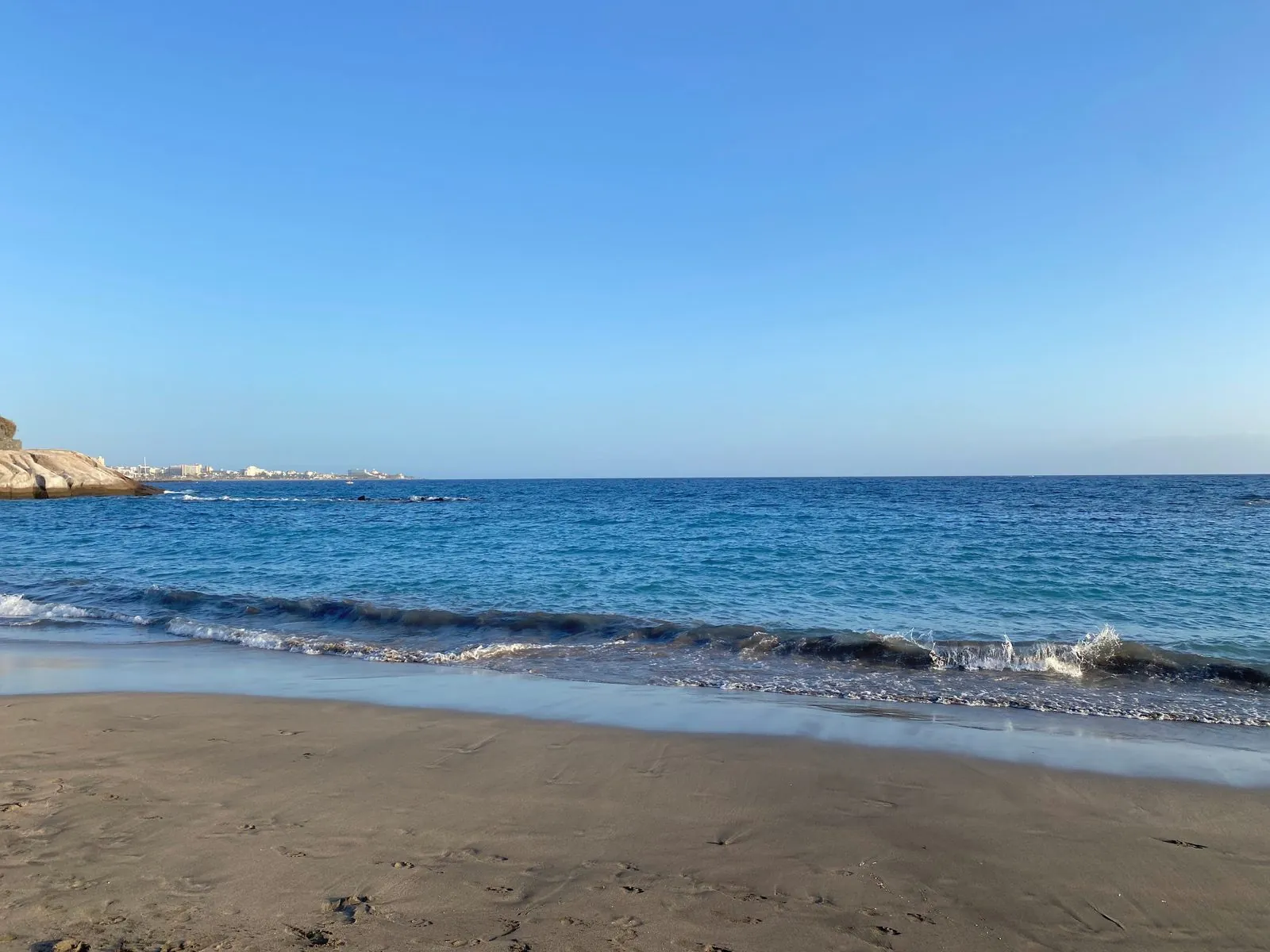 Golden sand and the resort promenade at Playa del Duque on the Costa Adeje, Tenerife