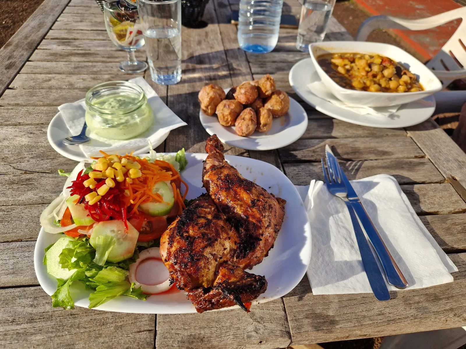A Canarian meal of roasted chicken with papas arrugadas, mojo and salad on La Palma