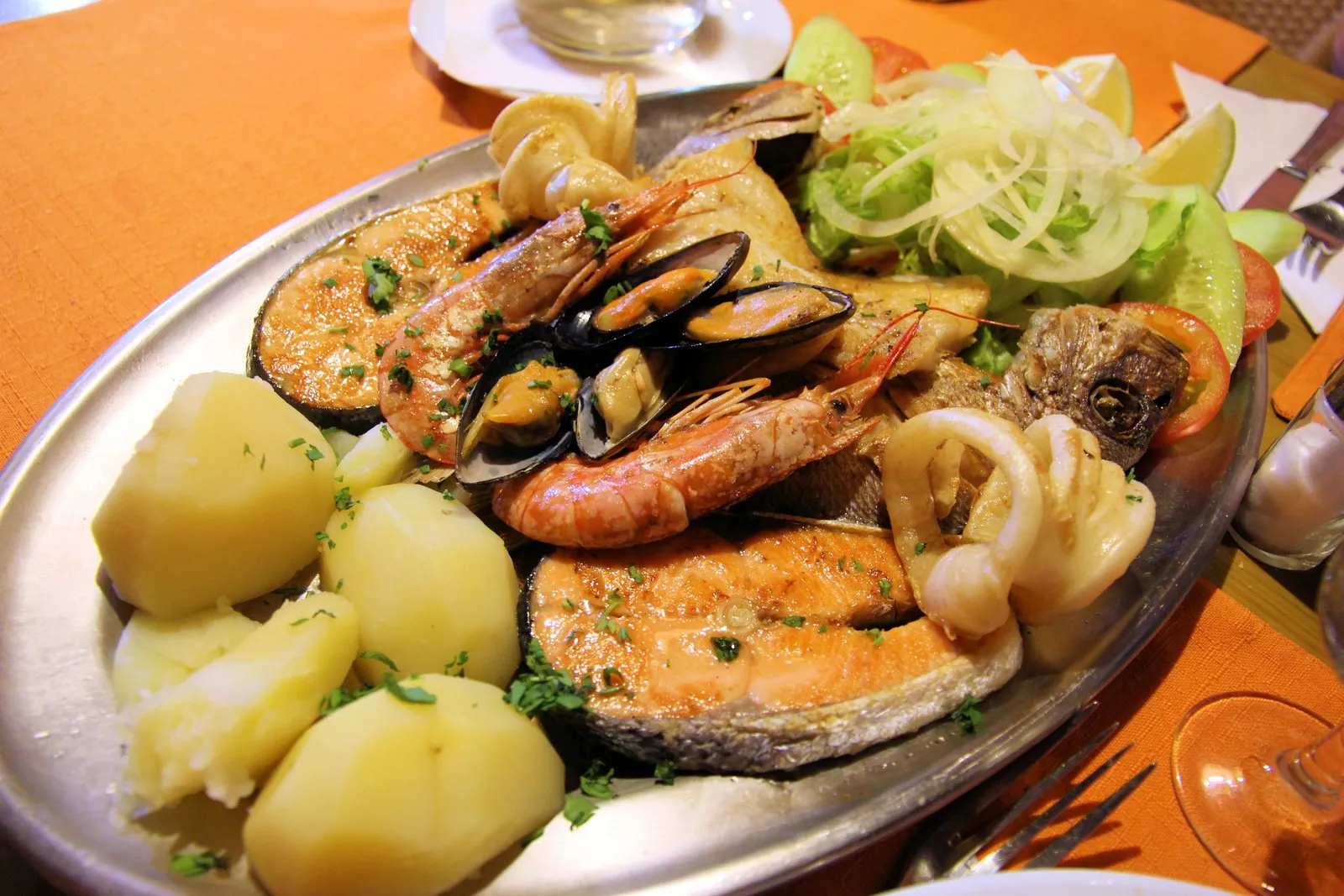 A restaurant plate of mixed grilled fish and seafood served in Gran Canaria