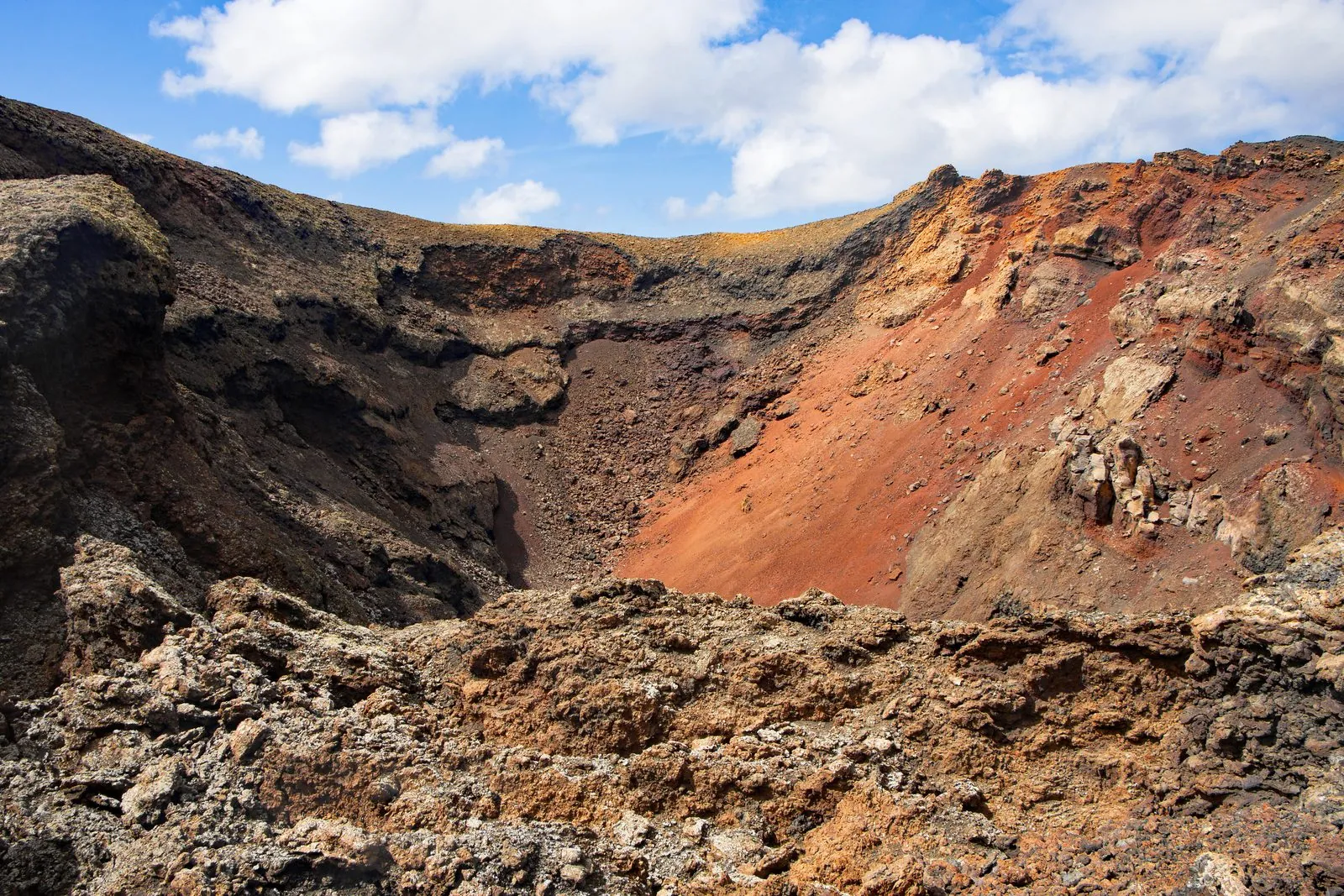Red and ochre volcanic crater landscape of Timanfaya National Park on Lanzarote