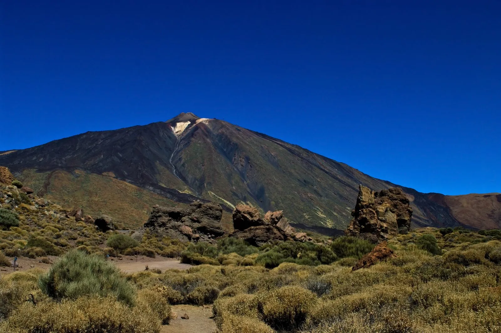 Snow-flecked summit of Mount Teide volcano above the crater plain of Tenerife