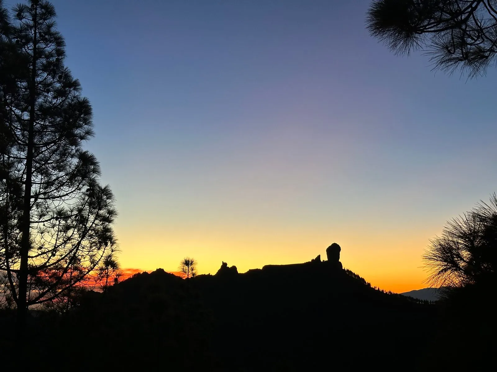 Sunbeams over the Roque Nublo rock formation, Gran Canaria