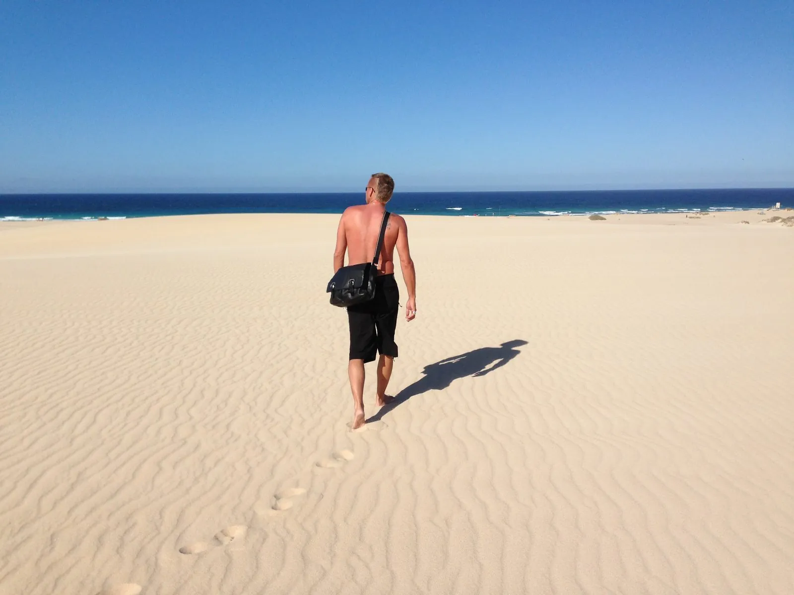A wide sandy dune looking out to the sea on Fuerteventura
