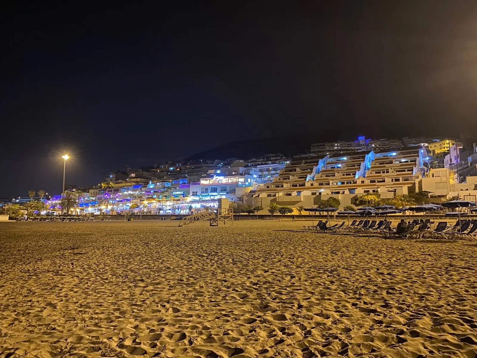 Sun loungers on the resort beach of Playa de las Vistas, Tenerife