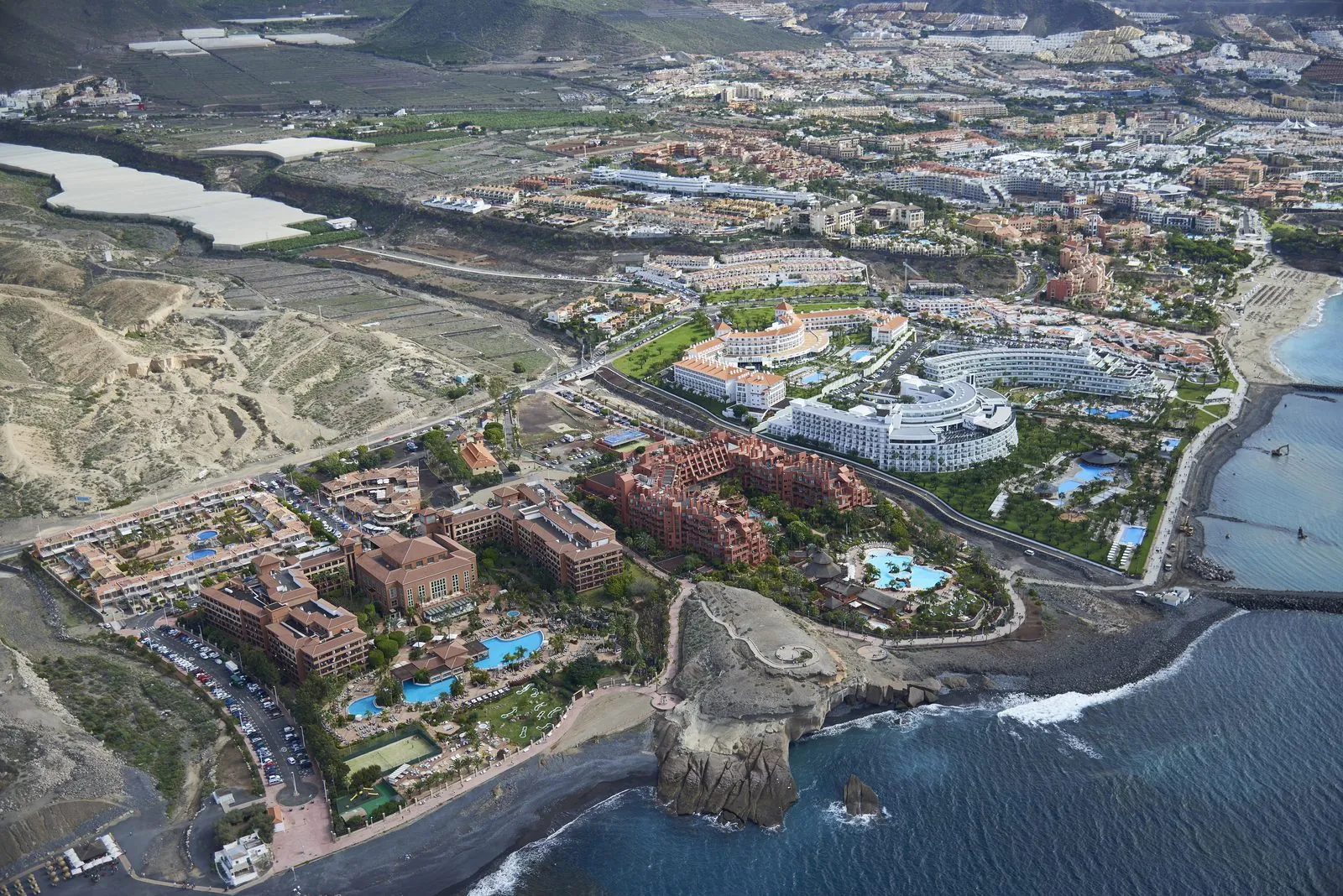 Aerial view of the resort hotels and pools along the Costa Adeje coast, Tenerife