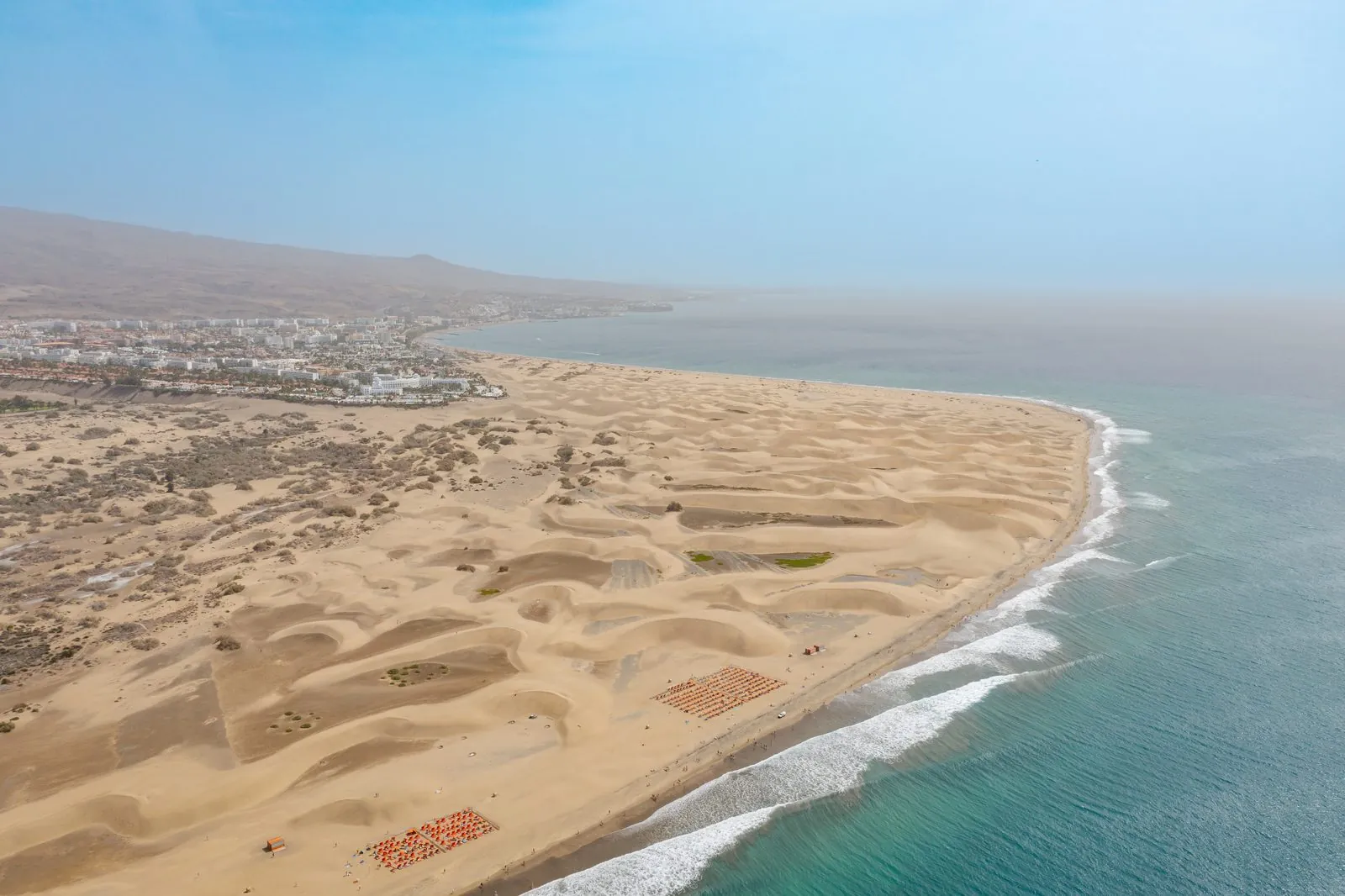 Aerial view of the sunny beach and dunes of Maspalomas on southern Gran Canaria