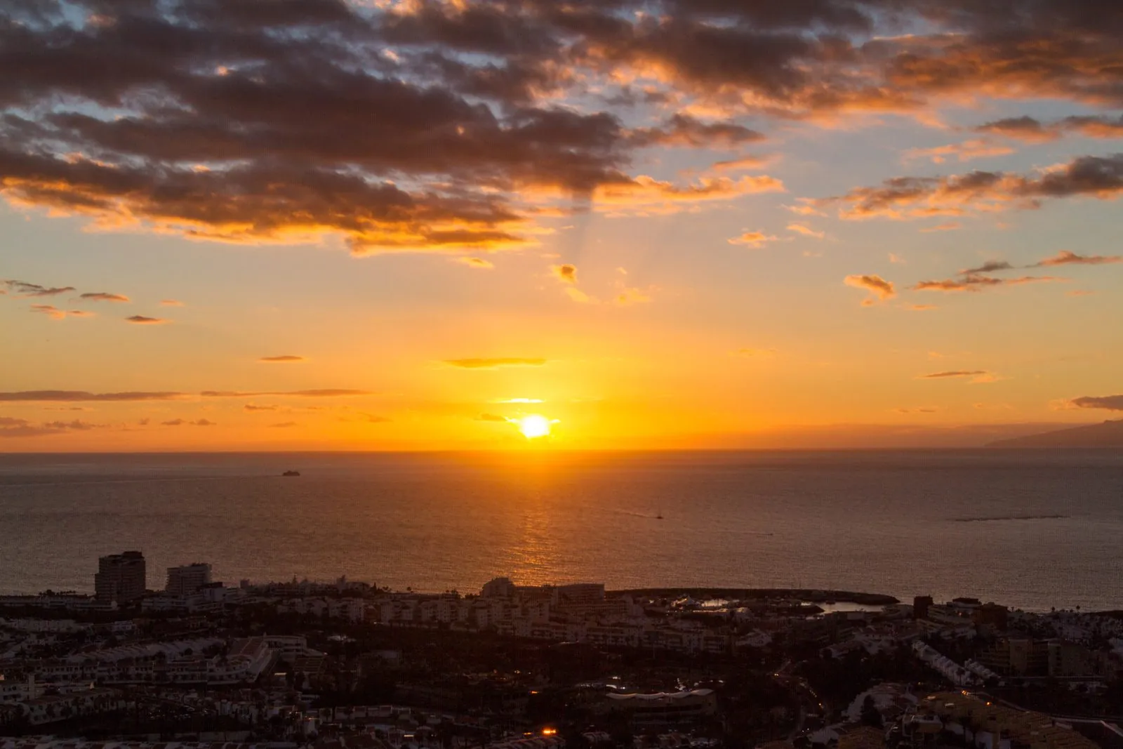 Sunset over the sea and coastline at Costa Adeje, southern Tenerife