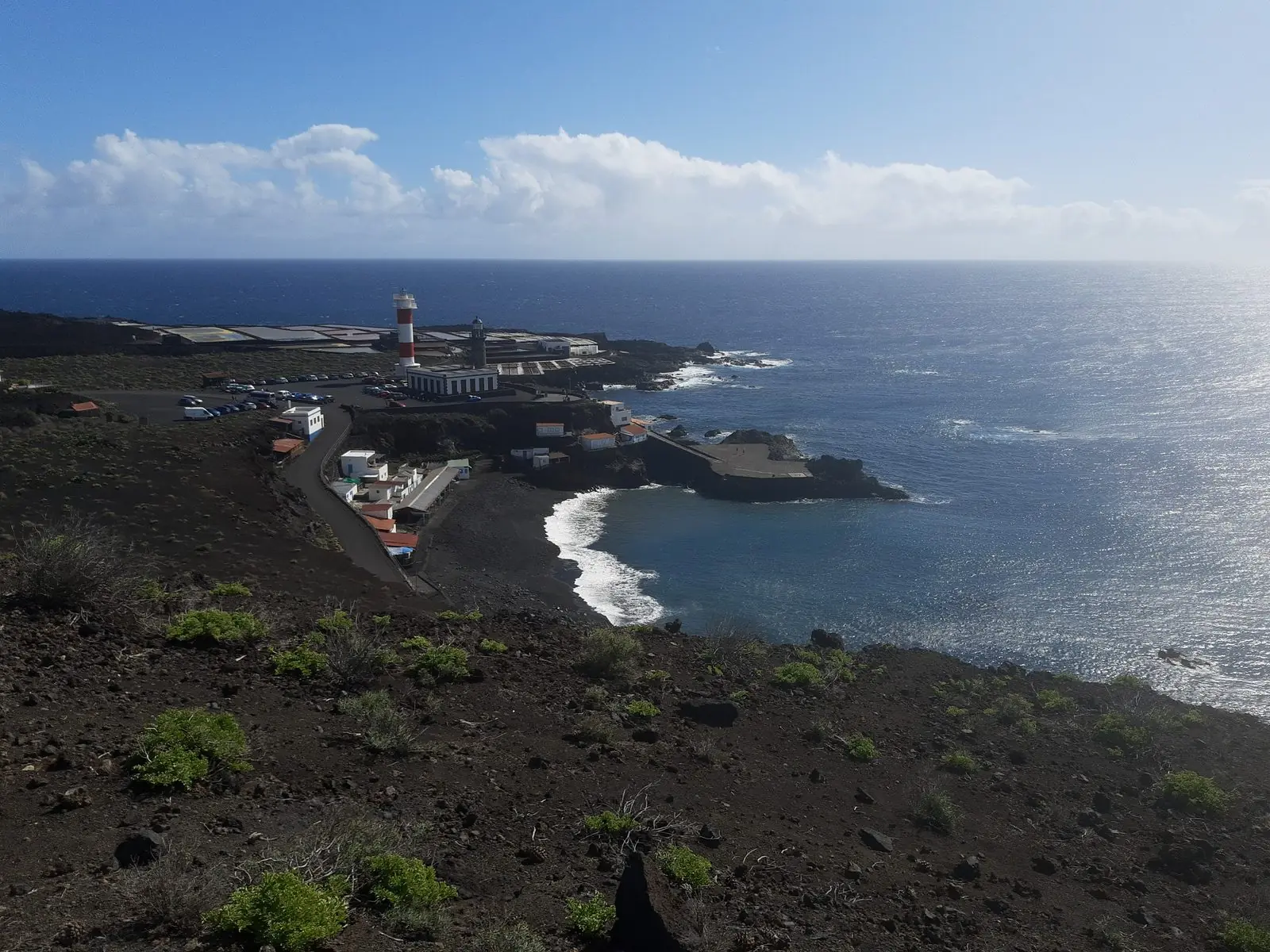 Lighthouse and salt pans on the volcanic coast below Fuencaliente, La Palma
