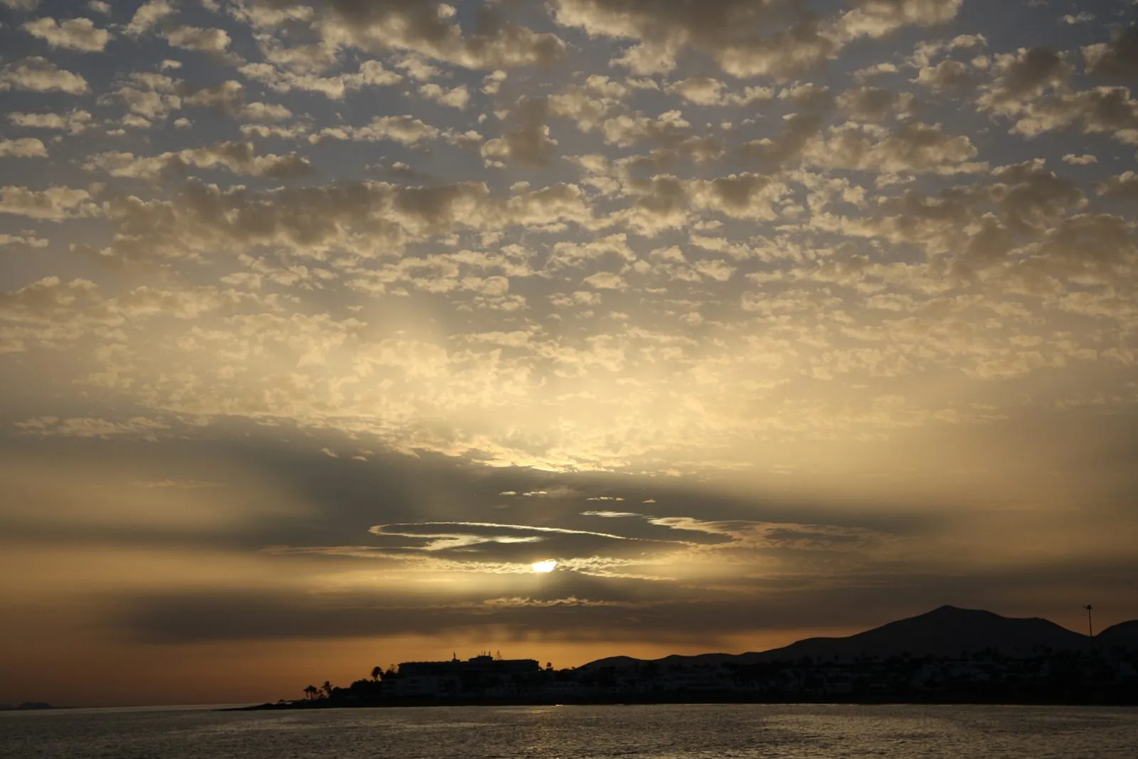 Evening light over the bay and beach at Puerto del Carmen, Lanzarote