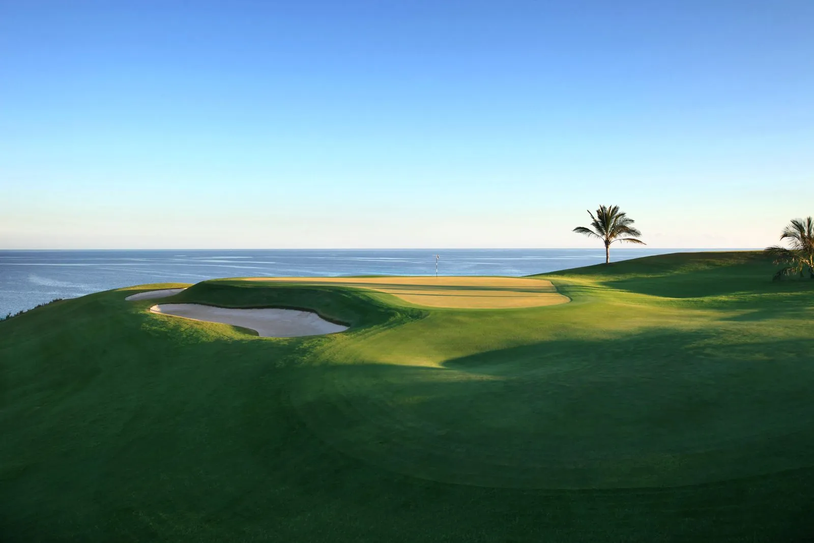 The manicured green and bunkers of Meloneras Golf on the coast of southern Gran Canaria