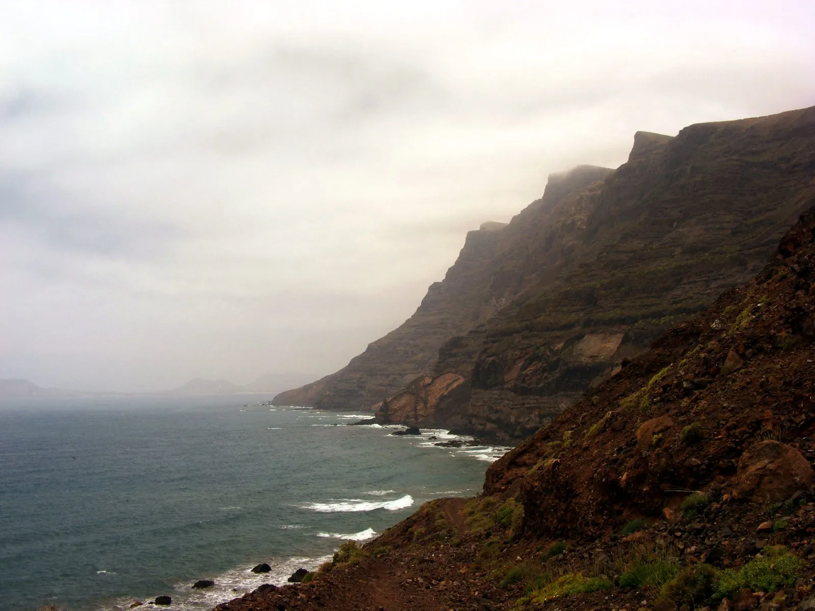 A cliff-top walking path along the Famara coast of Lanzarote