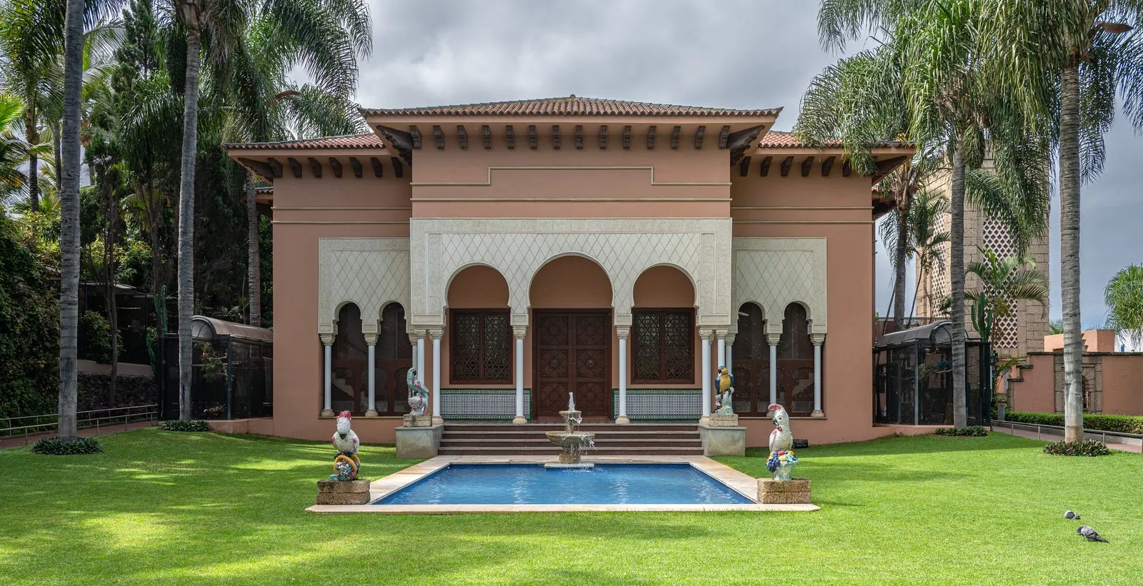 The ornate pink pavilion and palm-lined lawns at Loro Parque, Puerto de la Cruz, Tenerife