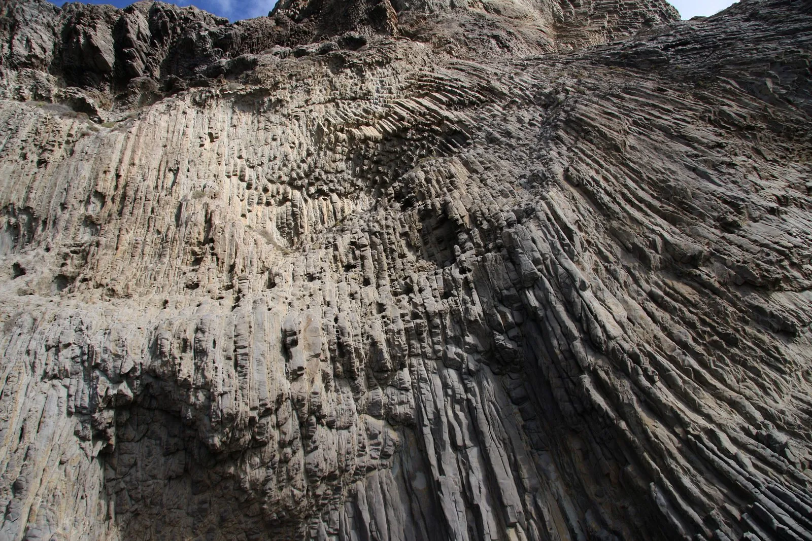 Close view of the vertical basalt columns of Los Órganos rising from the sea, La Gomera