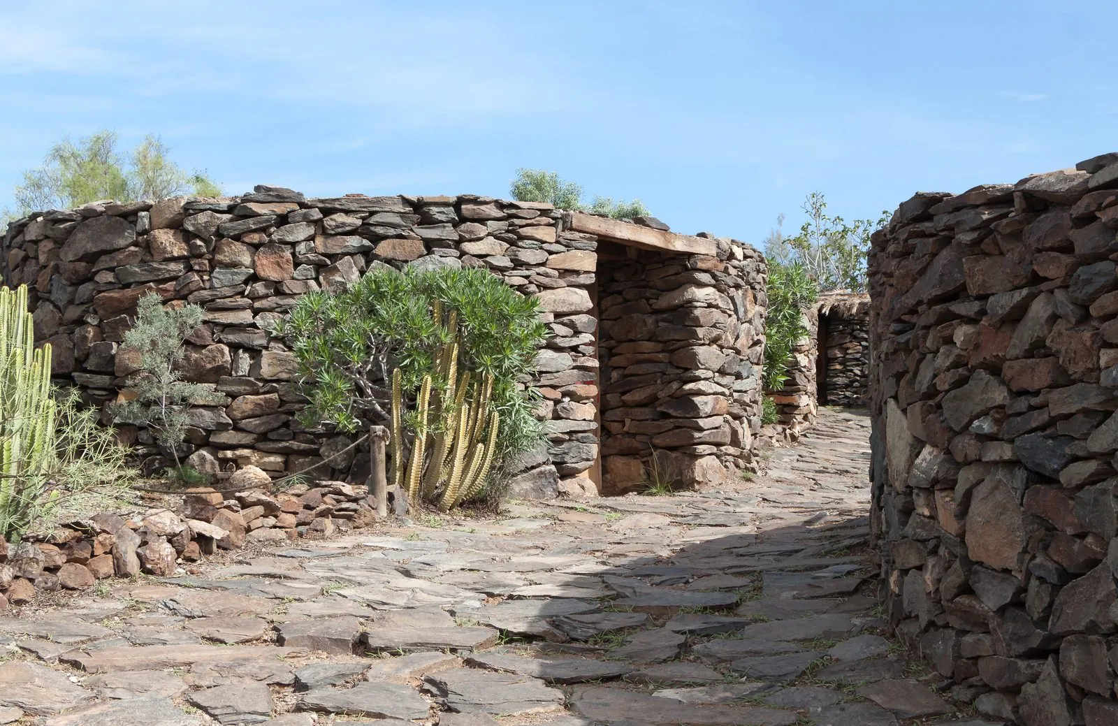 Reconstructed Guanche stone dwellings at the Mundo Aborigen open-air museum near Maspalomas, Gran Canaria
