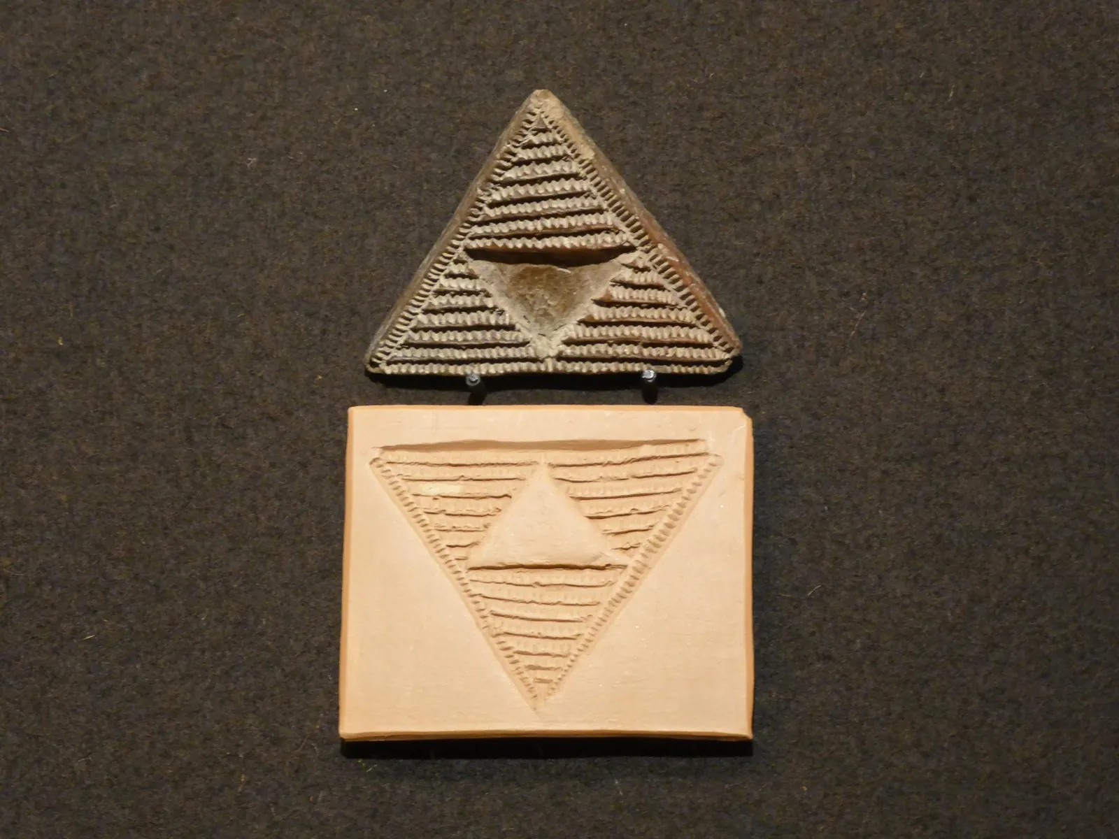 An aboriginal Guanche pintadera (clay stamp) on display at El Museo Canario, Gran Canaria