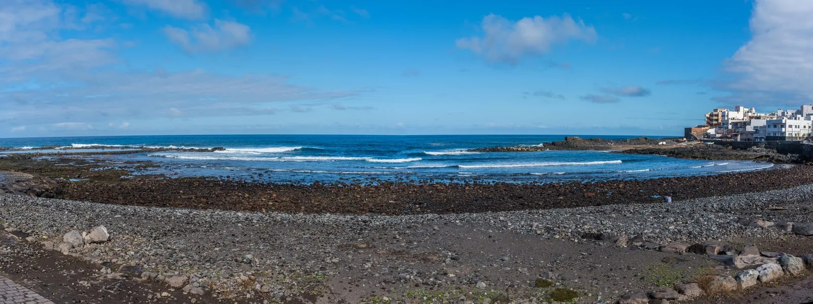 Panorama of the Atlantic coastline and tidal pools at El Puertillo, Gran Canaria