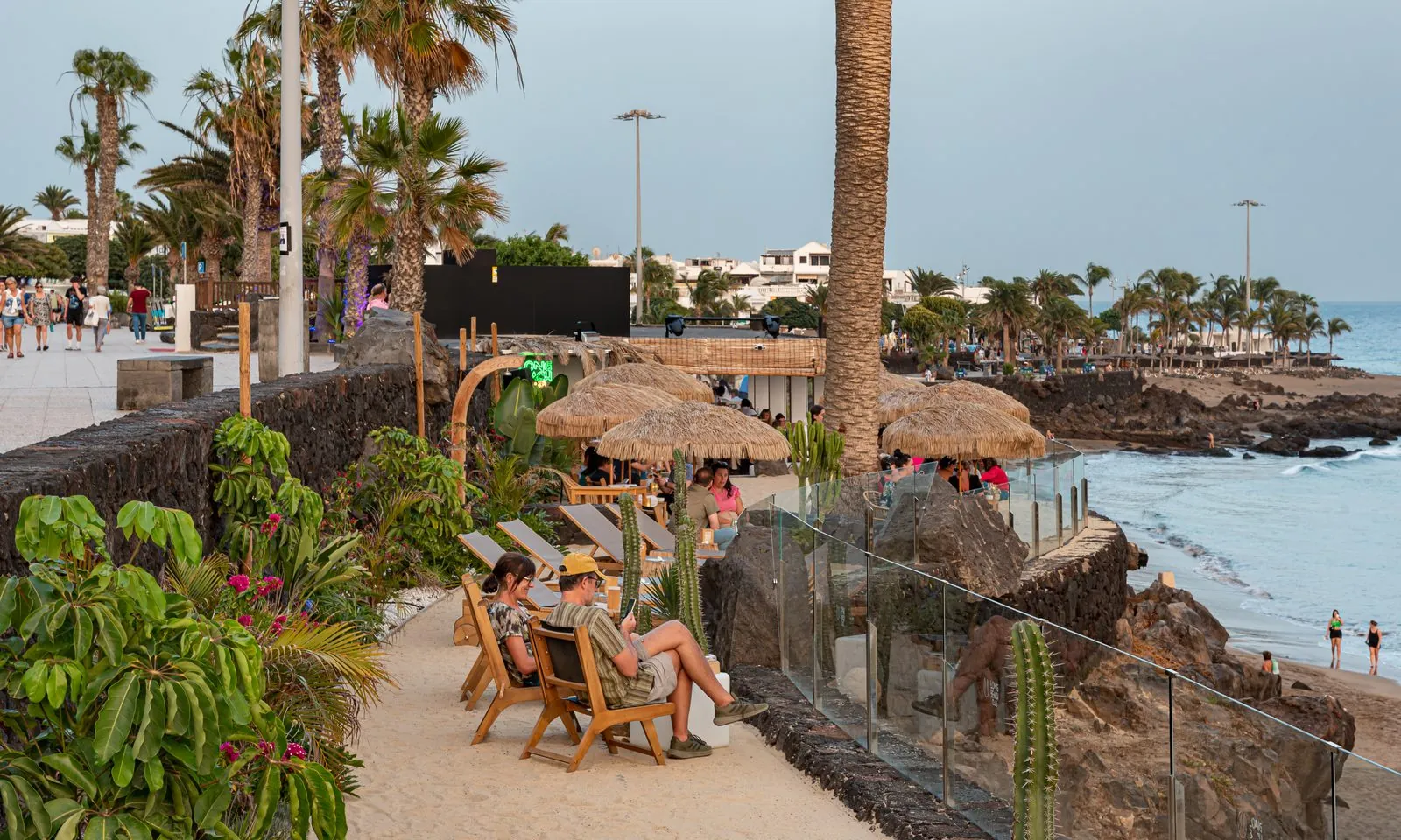 Beach-bar promenade at dusk on the Avenida de las Playas, Puerto del Carmen, Lanzarote