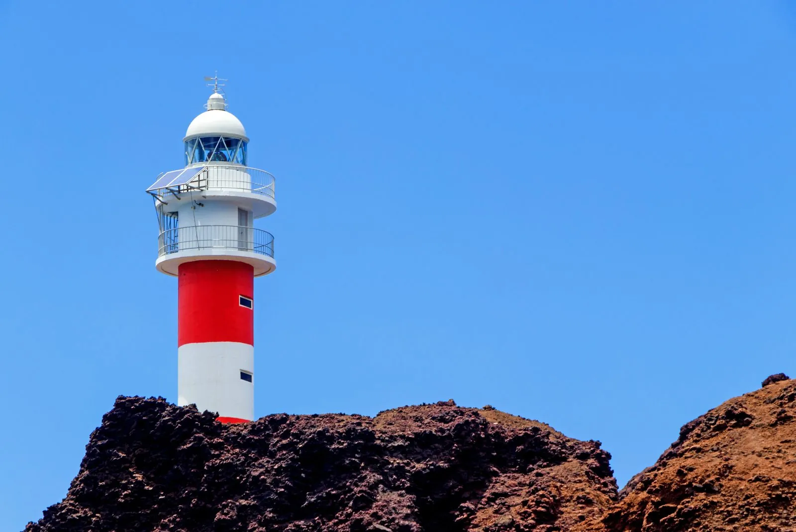 The lighthouse of Faro de Teno above the ocean at Punta de Teno, Tenerife