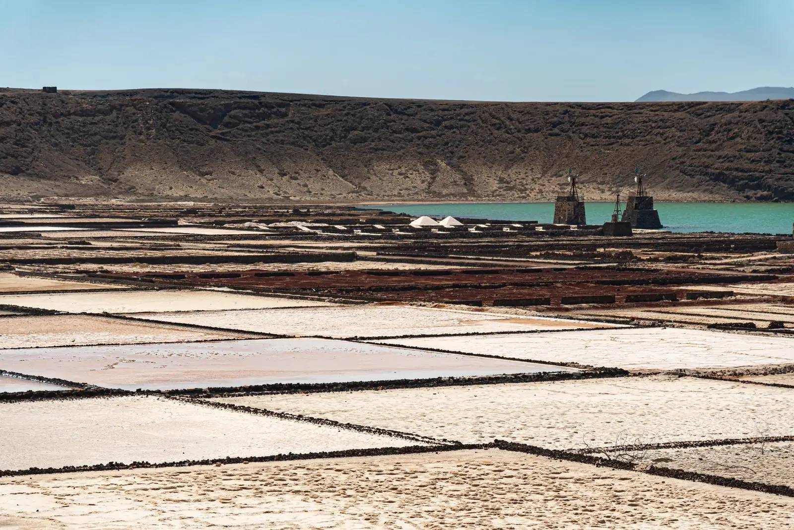 The geometric evaporation basins of the Janubio salt works beside the sea, Lanzarote
